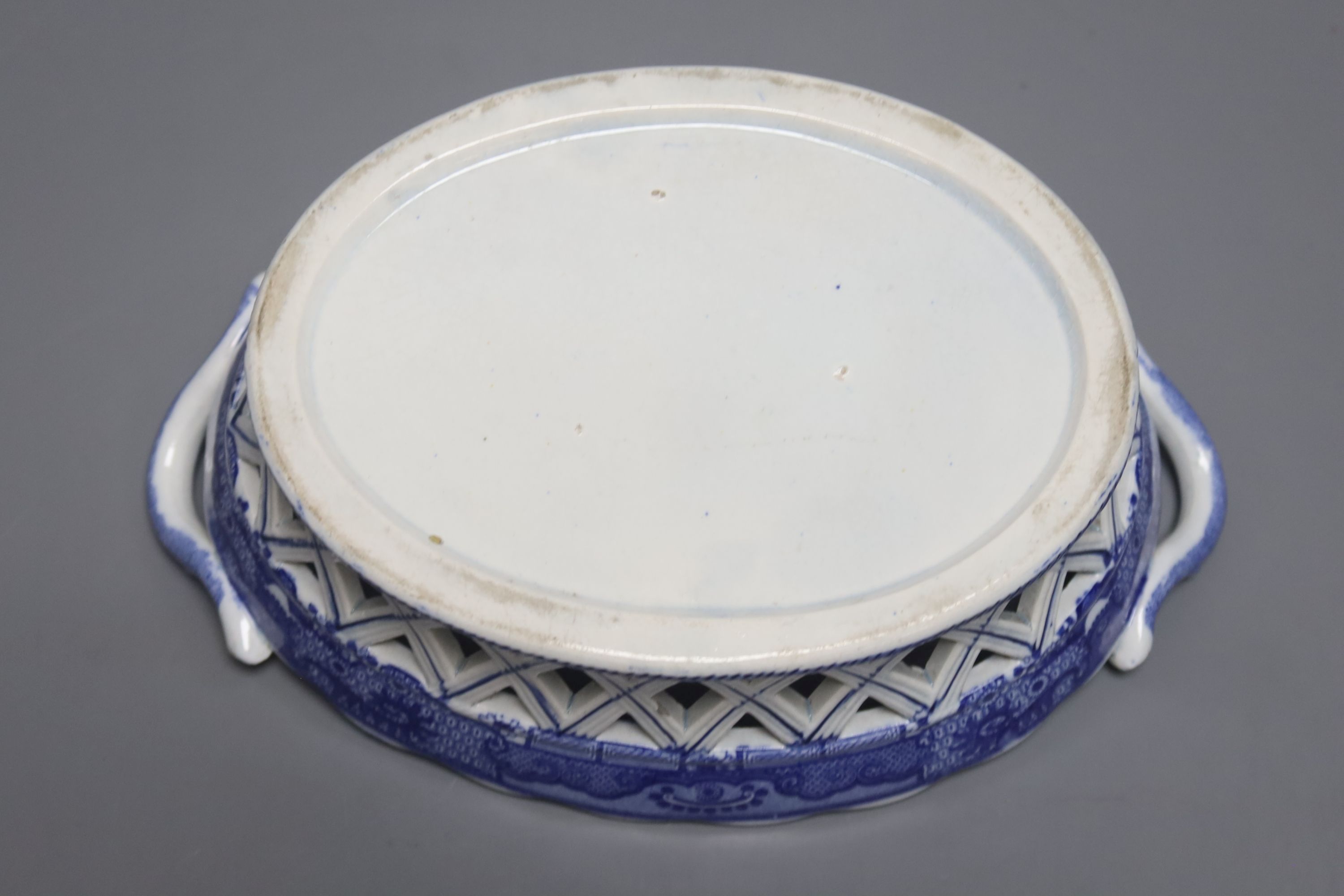 An English pottery basket printed in under glaze blue with stylised motifs probably Spode, length 23.5cm